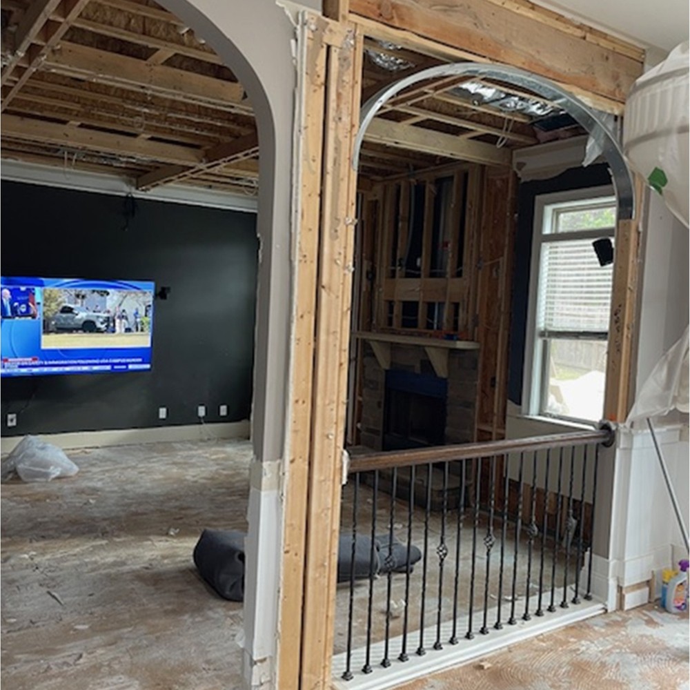 Living room ceiling opened to the joists after an upstairs water release