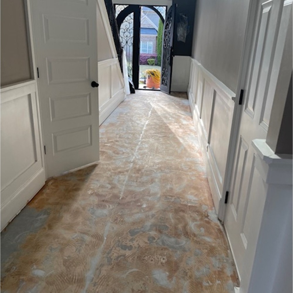 Hallway flooring removed to the subfloor after standing water