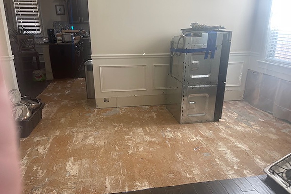 Saturated flooring removed and contents staged during machine drying