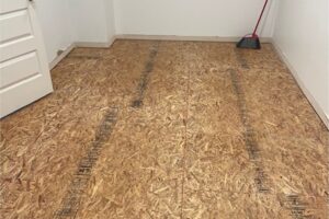 Room stripped to the subfloor after hidden water damage