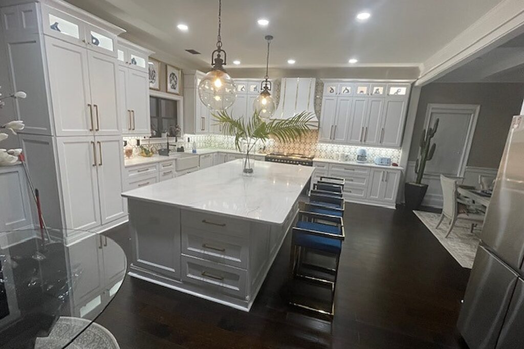 Rebuilt kitchen with white cabinetry and quartz island in Dacula GA