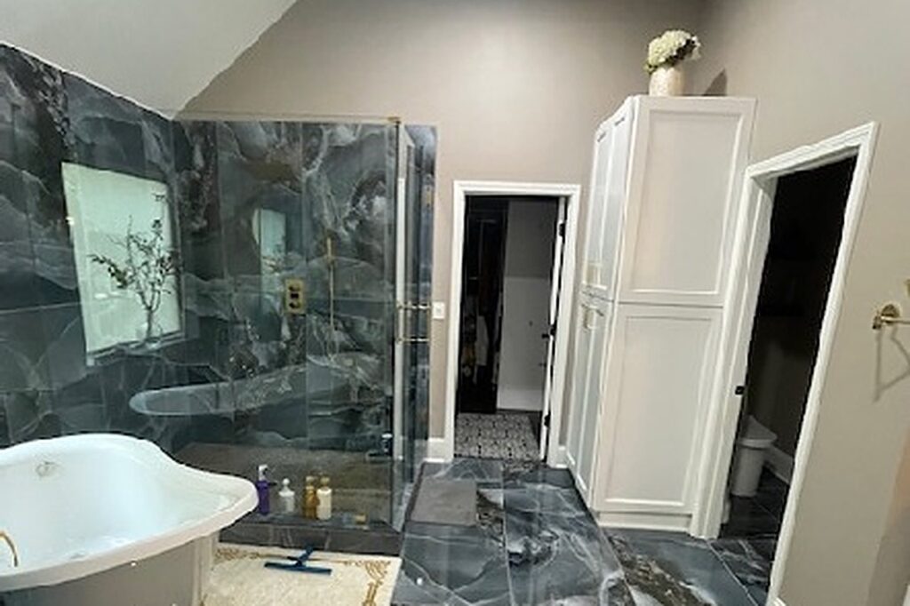 Rebuilt master bathroom with freestanding tub and glass shower in Dacula GA
