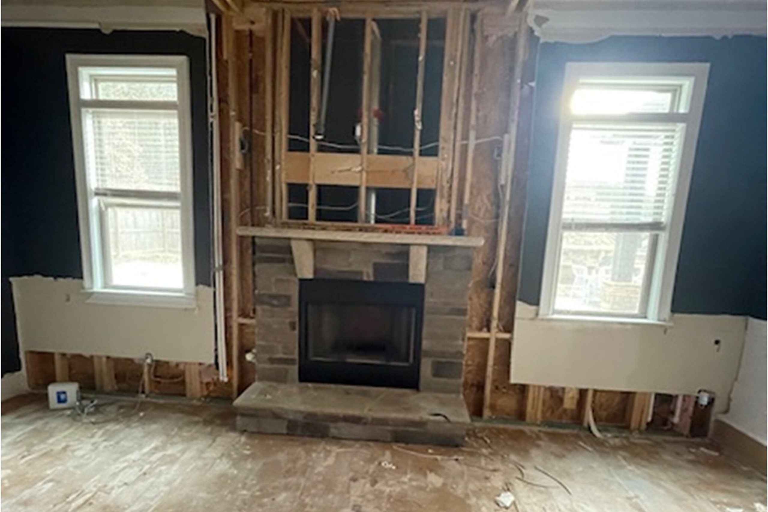 Living room water damage from an upstairs plumbing failure in Dacula GA