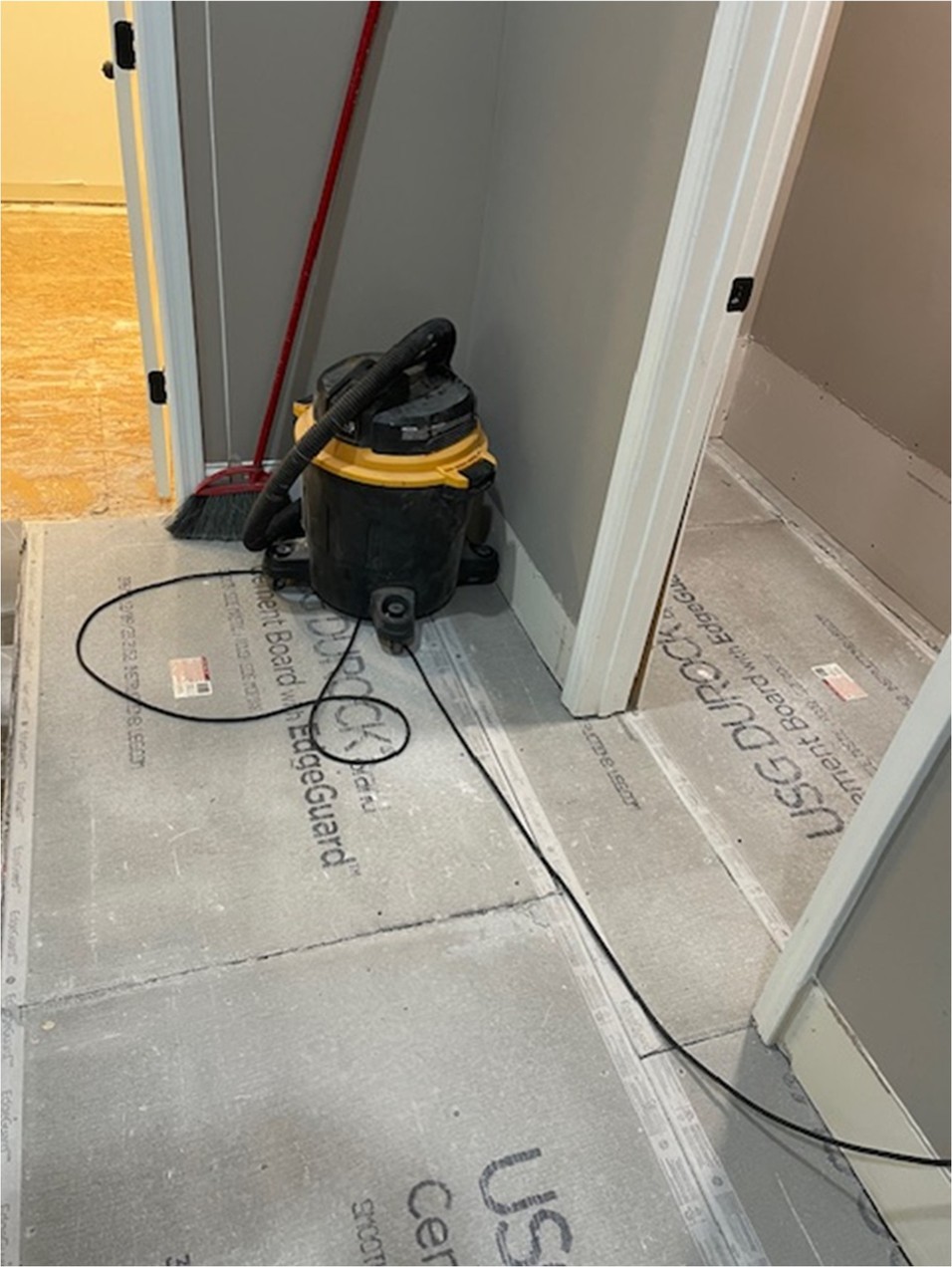 Cement board subfloor installed before tile during water damage reconstruction in Dacula GA