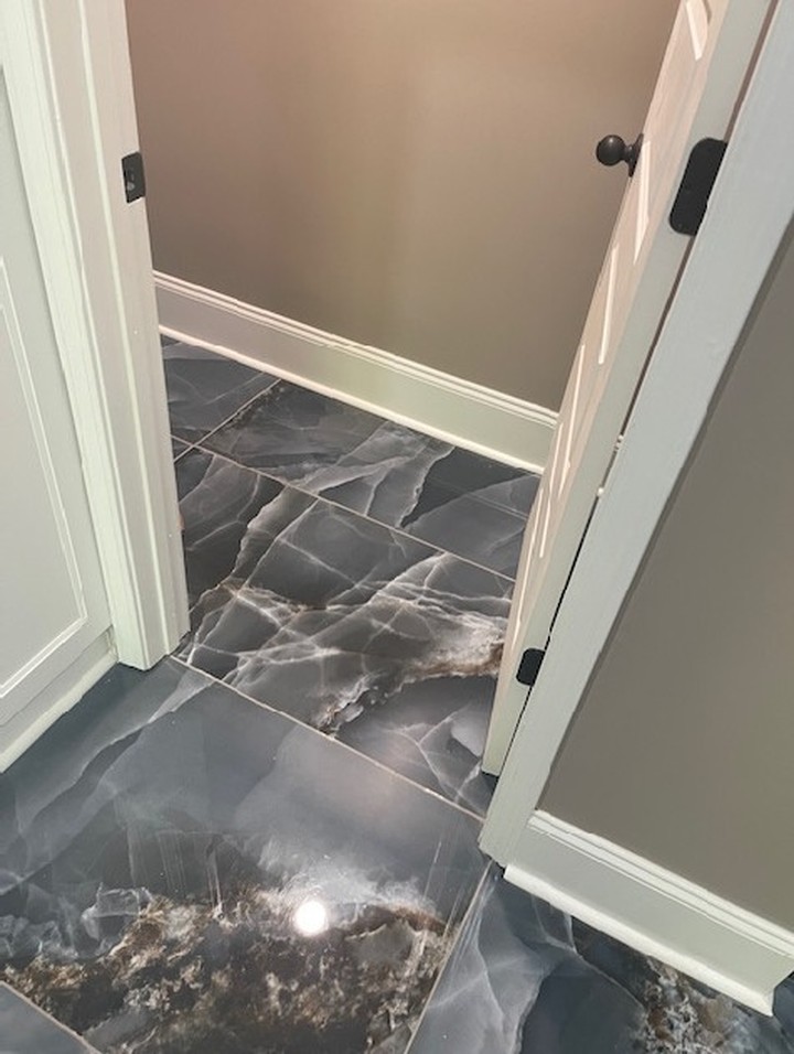 New bathroom tile floor after water damage restoration in Gwinnett County GA