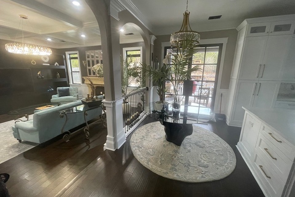 Restored breakfast nook with chandelier after water damage in a Georgia home