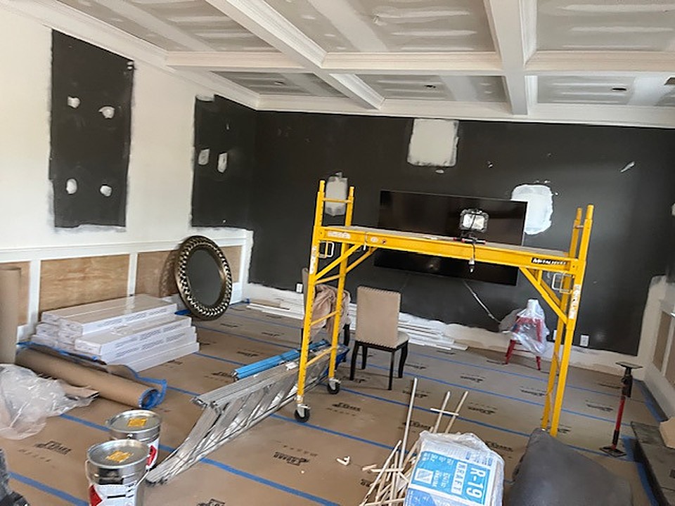Scaffolding during a coffered ceiling rebuild in a Dacula living room