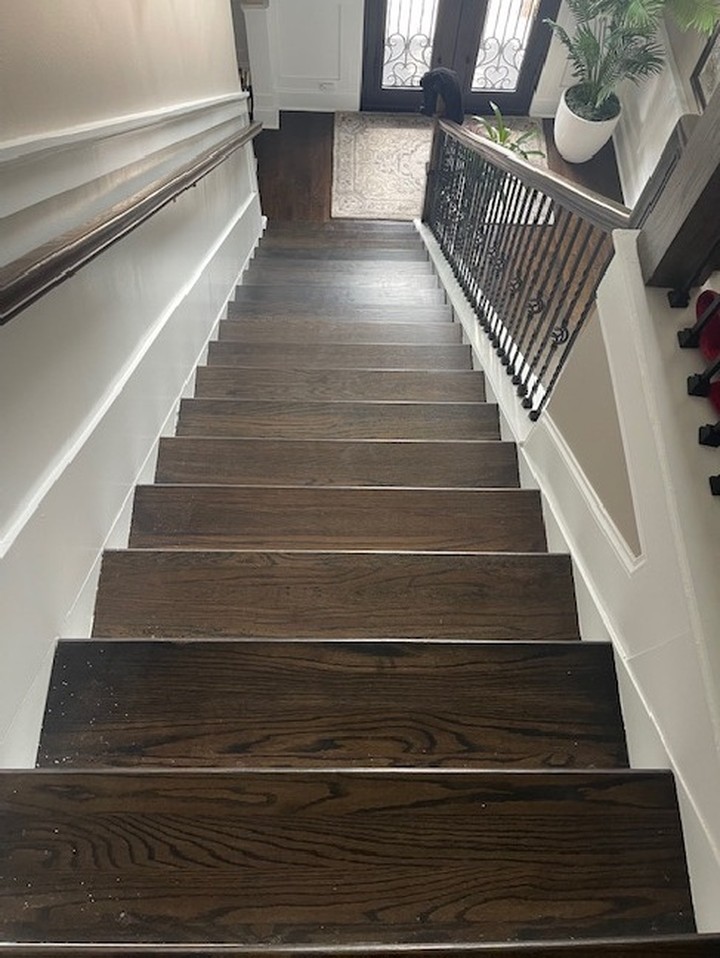 Finished oak staircase after water damage restoration in a Georgia home