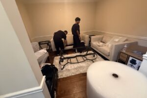 Furniture wrapped and protected before a pack-out in a metro Atlanta home