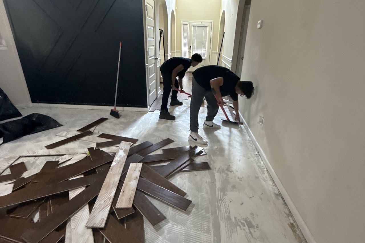 Water-damaged flooring planks removed during mitigation in a Gwinnett County home